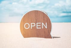 Open sign on the beach